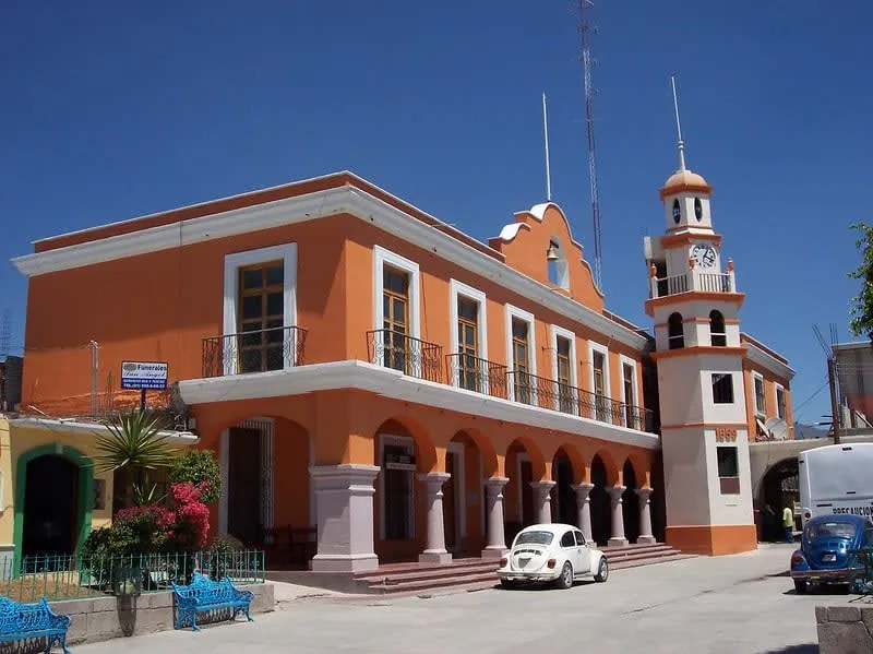 Mitla Municipal Palace with arched portals and a central clock tower
