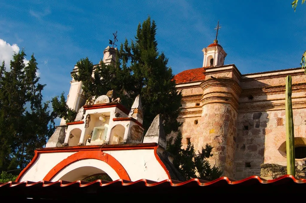 Church of San Pablo rising above Zapotec stonework in Mitla