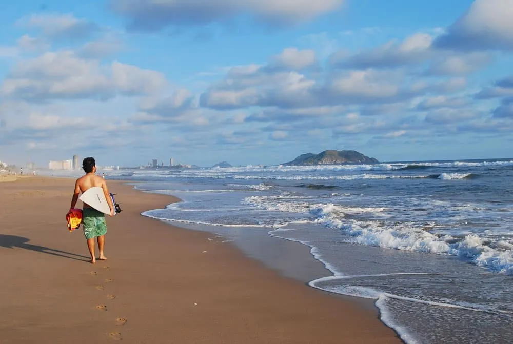 Olas Altas Beach with darker sand and stronger surf near Manzanillo