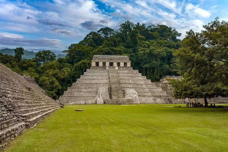 Palenque ruins rising from the Chiapas jungle — the starting point before the climb to San Cristóbal de las Casas