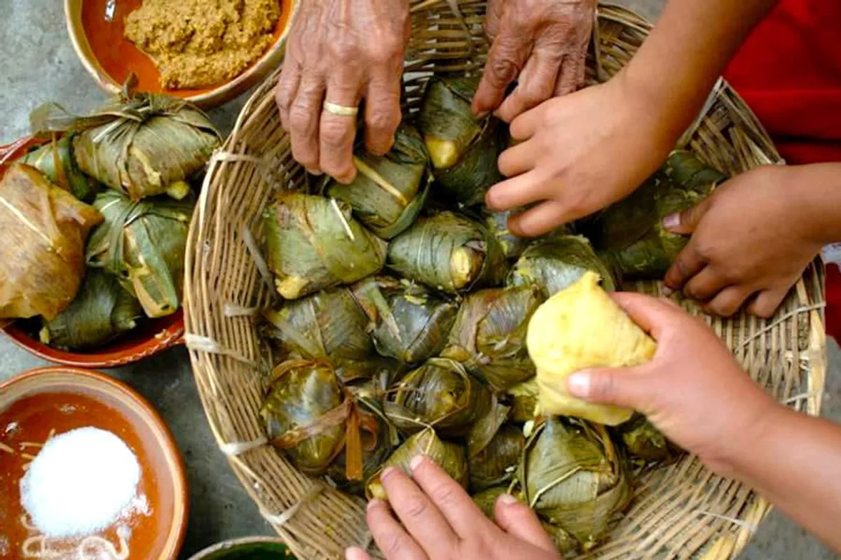 Traditional Michoacán food including corundas and white fish tamales in Pátzcuaro