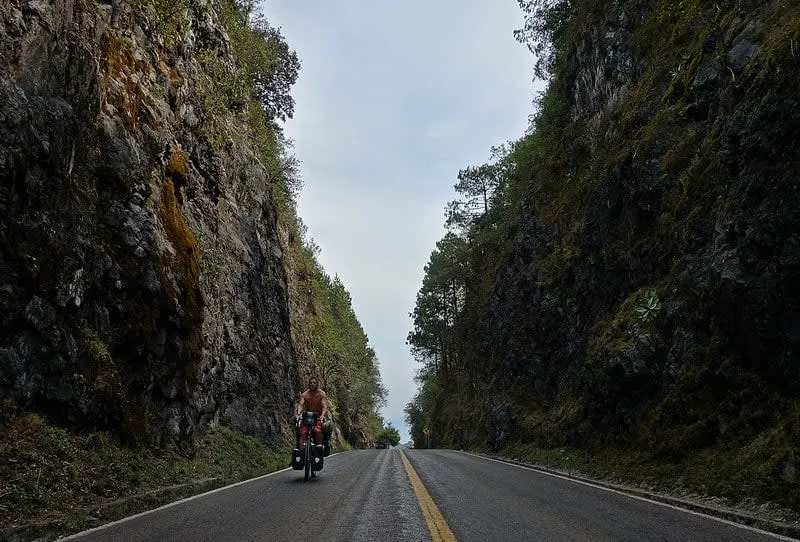 Sierra Gorda mountain route near Jalpan de Serra in August with green hills, mission towns, and rainy-season road planning