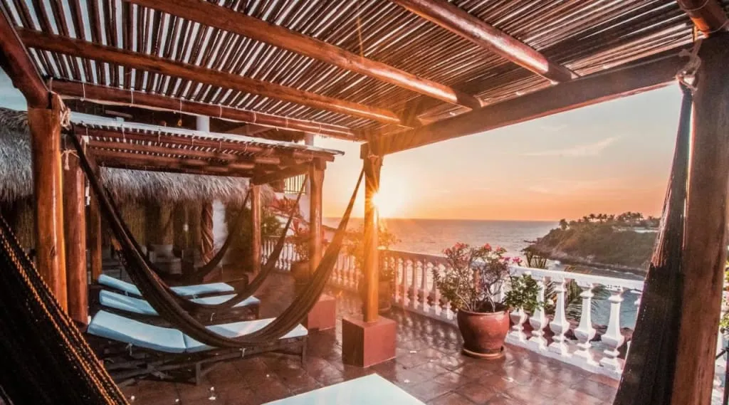 Clifftop villas and terrace dining above the sheltered bay