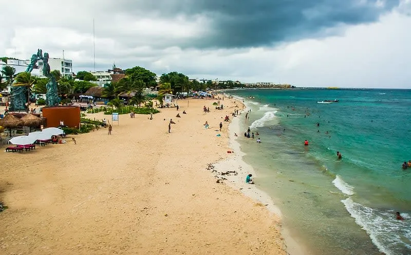 Playa del Carmen beach during January low season with clear turquoise Caribbean water and white sand