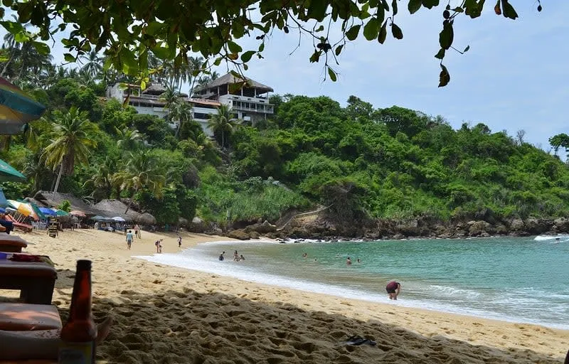 Carrizalillo cove in Puerto Escondido — a sheltered turquoise bay with steps leading down to the beach, Oaxaca Mexico