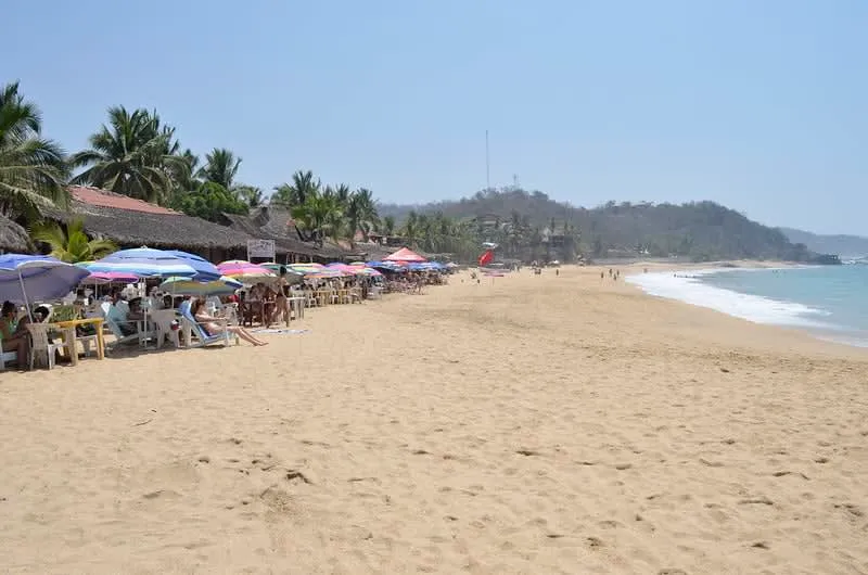 Small bay and cliffs at Mazunte, a coastal village on the Oaxacan coast near Puerto Escondido — a popular day trip destination