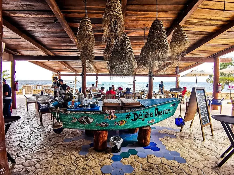 Puerto Morelos waterfront restaurant in June with warm evening trip planning