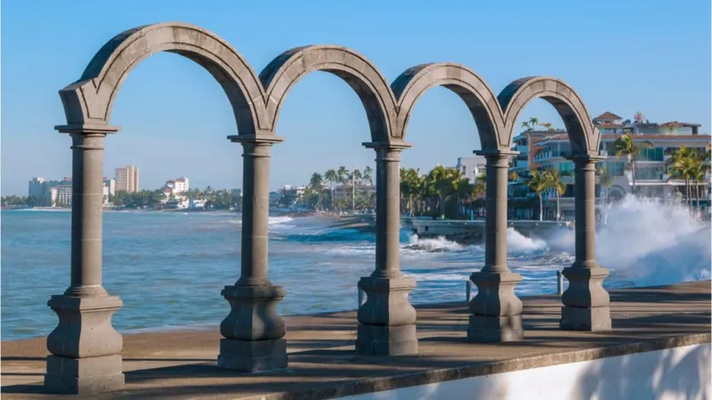 Puerto Vallarta coastline with high-rise resorts, green hills, and open Pacific water