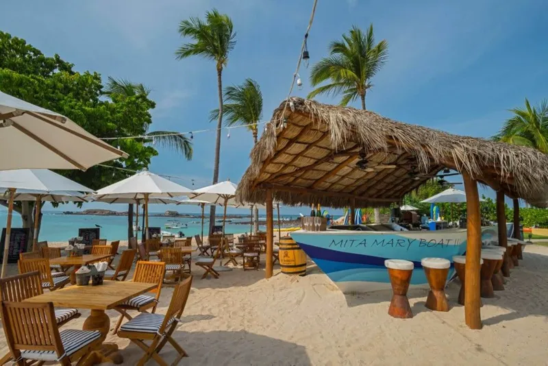 Punta Mita beach with umbrellas and calm Pacific water