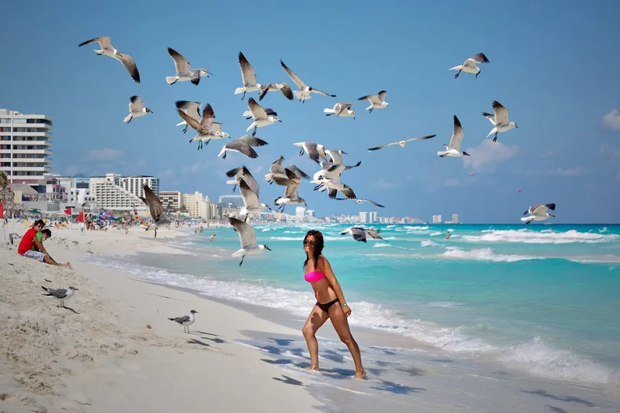 Cancún Hotel Zone nightlife during Semana Santa with crowded bars and clubs lit up at night along the strip