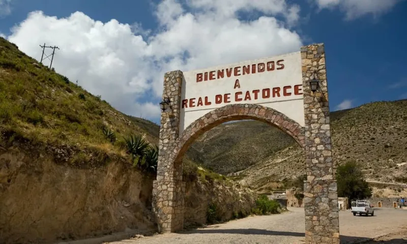 Real de Catorce stone street under rainy August high-desert clouds