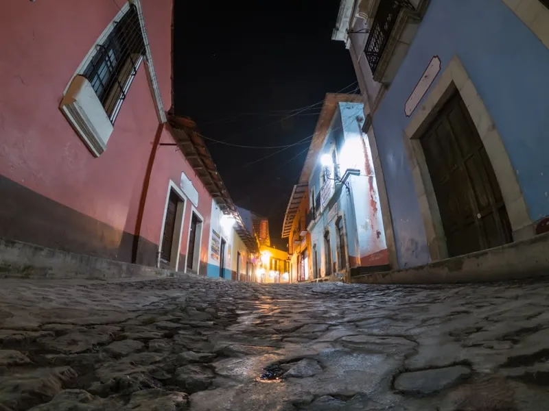 Sloping Real del Monte street during cool January travel in Hidalgo