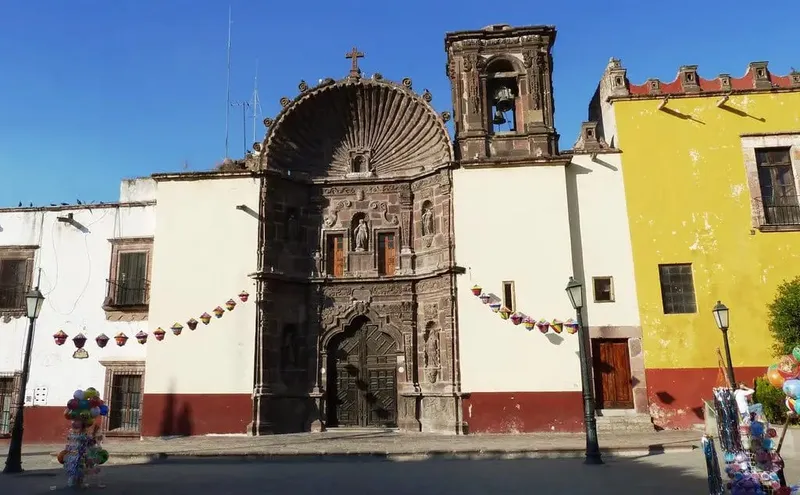 San Miguel de Allende colonial church and architecture on cobblestone street