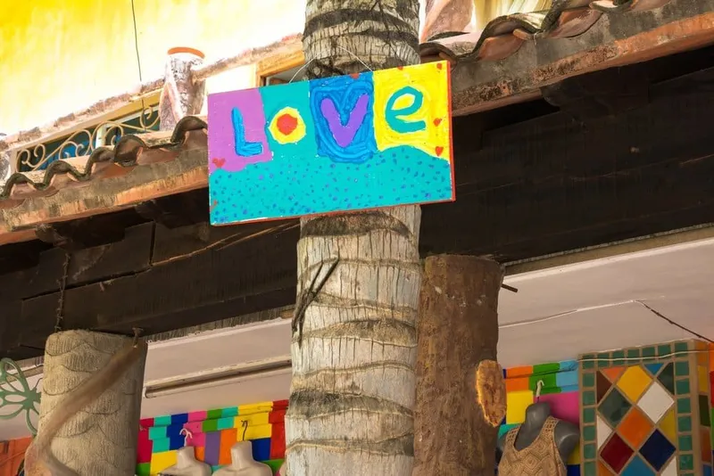 Colorful Sayulita street with surf shops and open-air cafes near the town center