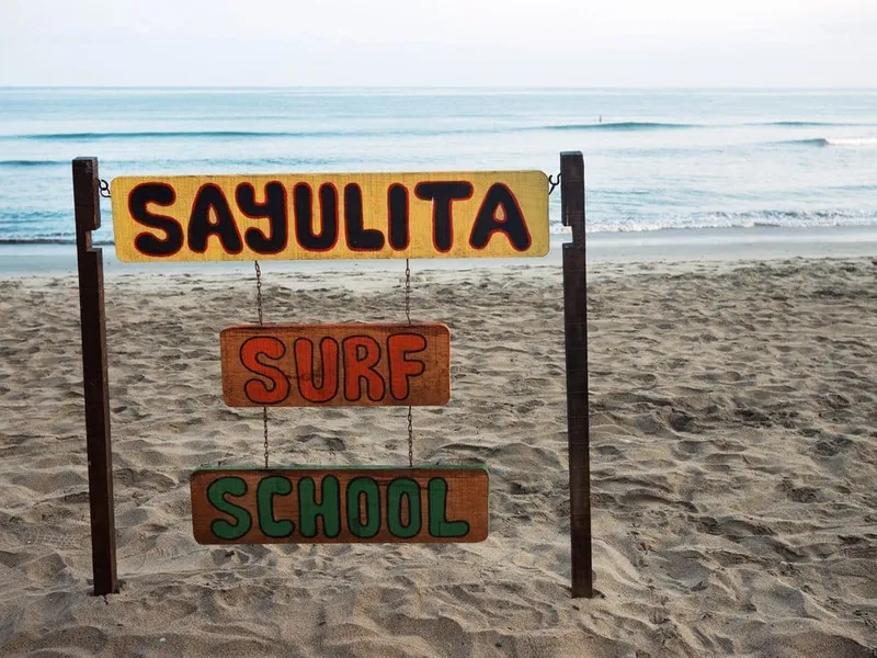 People watching the sunset from the sand on Sayulita's main beach