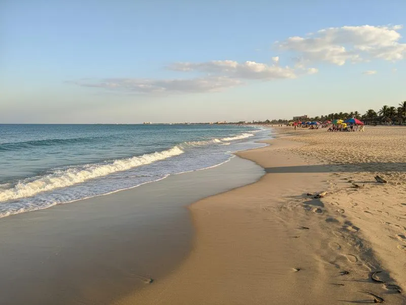 Miramar Beach near Tampico in July with hot Gulf water, regional beach crowds, and summer weather planning
