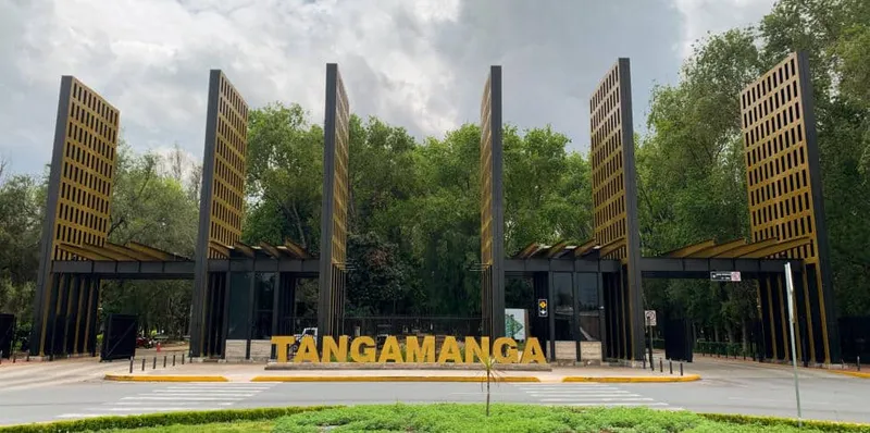 Tree-lined paths and open lawns inside Tangamanga Park in San Luis Potosi