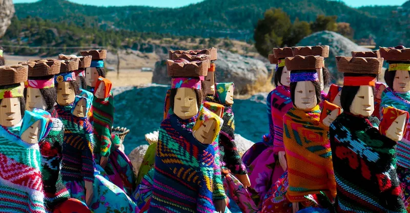 Rarámuri (Tarahumara) woman in traditional dress weaving in the Copper Canyon region of Chihuahua, Mexico — crafts available in Chihuahua City markets
