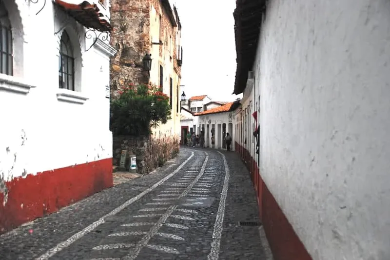 Steep whitewashed streets climbing through Taxco's hillside center