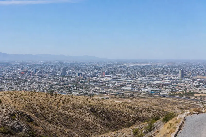 July desert view over Torreon with Cristo de las Noas and hot Coahuila light