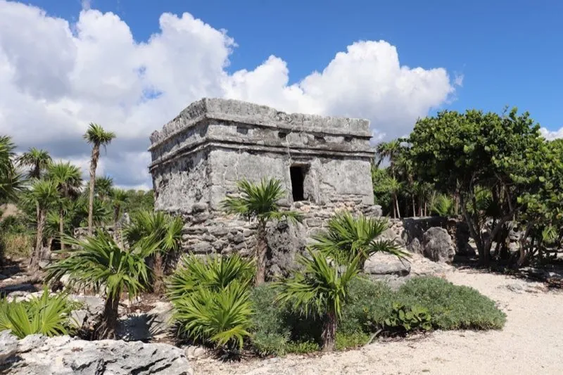 Tulum Maya archaeological zone ruins with jungle vegetation and Caribbean coastline, Quintana Roo Mexico