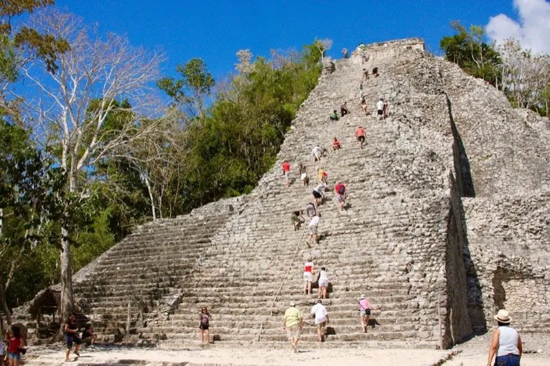 Nohoch Mul pyramid at Coba Maya archaeological zone surrounded by Yucatan jungle, Quintana Roo Mexico