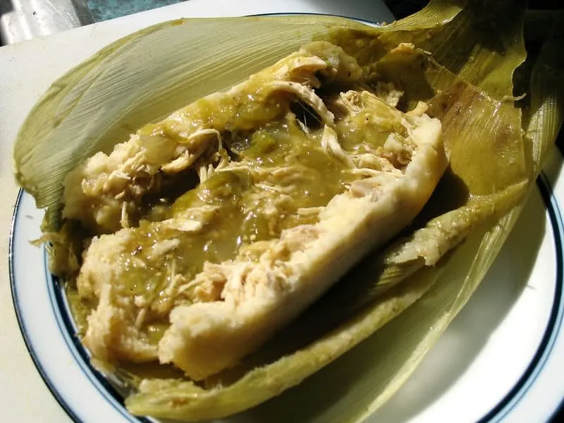 Green salsa tamales wrapped in corn husks