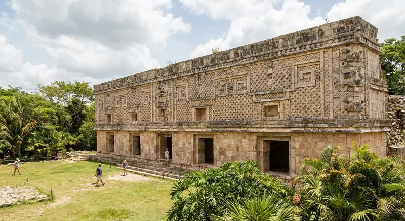 Uxmal Governor's Palace long elegant stone facade intricate stone mosaic carvings Yucatan Mexico Maya ruins