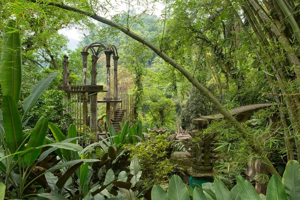 Concrete surrealist structures rising through jungle plants at Las Pozas near Xilitla