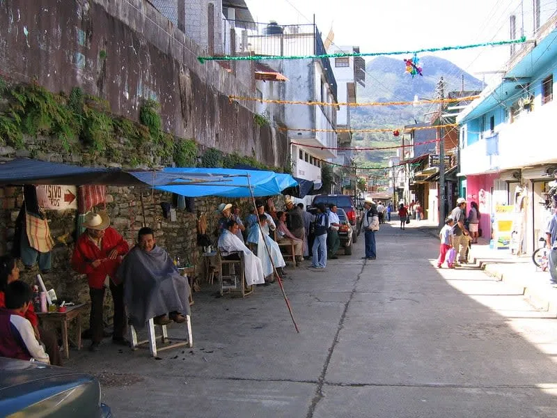 Colorful homes and steep streets on a humid evening in Xilitla