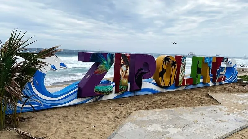 Wide Zipolite beach with Pacific surf during May weather on the Oaxaca Coast