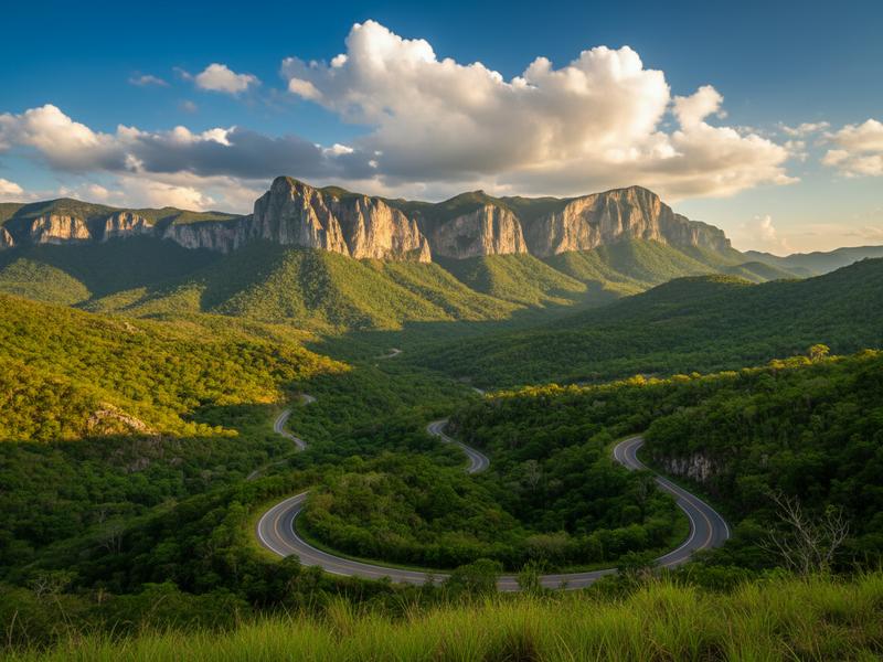 Scenic road through green mountains approaching Tamasopo