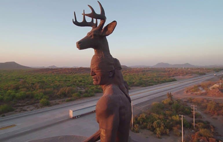 Large deer statue near Ciudad Obregón during a hot June Sonora trip
