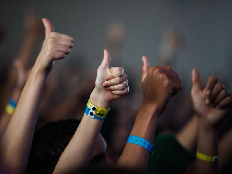 Corona Capital festival wristbands, phone, and passport arranged before entry