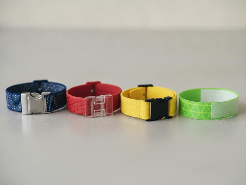 Color-coded festival wristbands representing general and premium Corona Capital ticket types