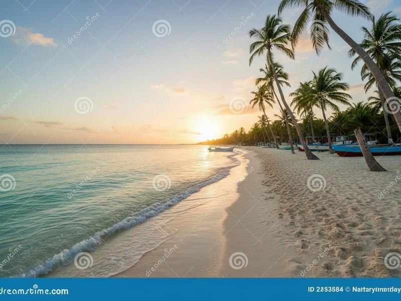Late-day Cozumel coastline with calm water and clouds over the channel