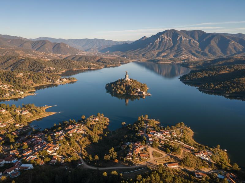 Traveler viewing Lake Pátzcuaro with Janitzio island and surrounding Michoacán communities