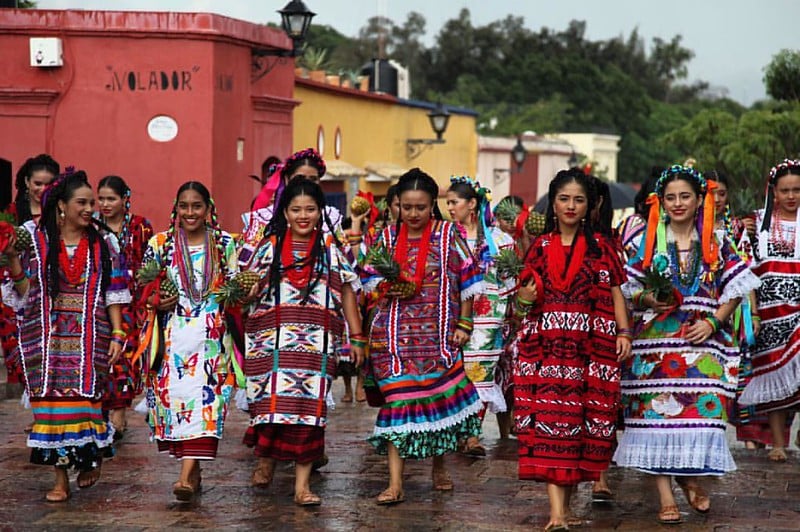 Guelaguetza dancers in traditional dress from the eight Oaxacan regions at the hillside auditorium