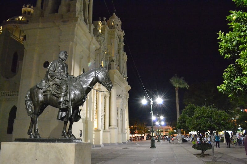 Equestrian statue and civic building in Hermosillo during a clear December Sonora evening