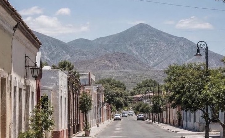 Warm April afternoon near Linares historic center with Nuevo Leon foothills beyond the streets