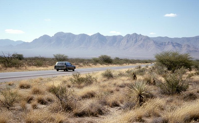 Open high-desert highway outside Matehuala during dry April travel season