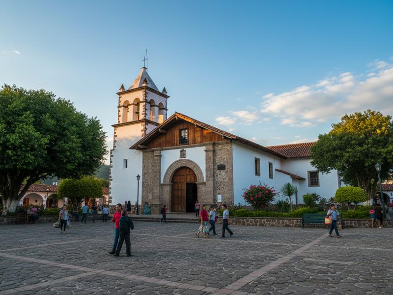 White church towers and wet stone streets under cloudy mountain weather