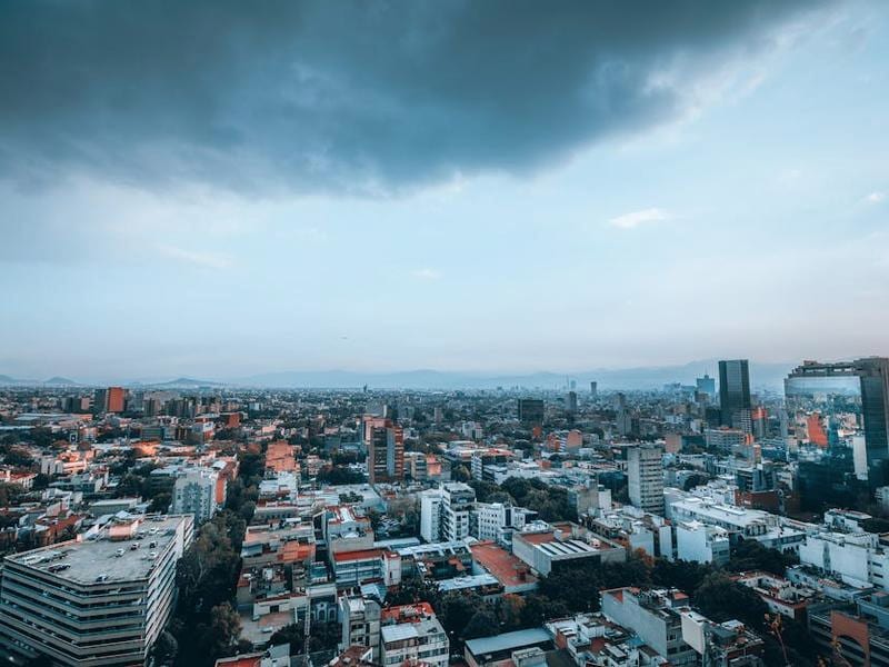 Clouds building over Saltillo rooftops during the late rainy season