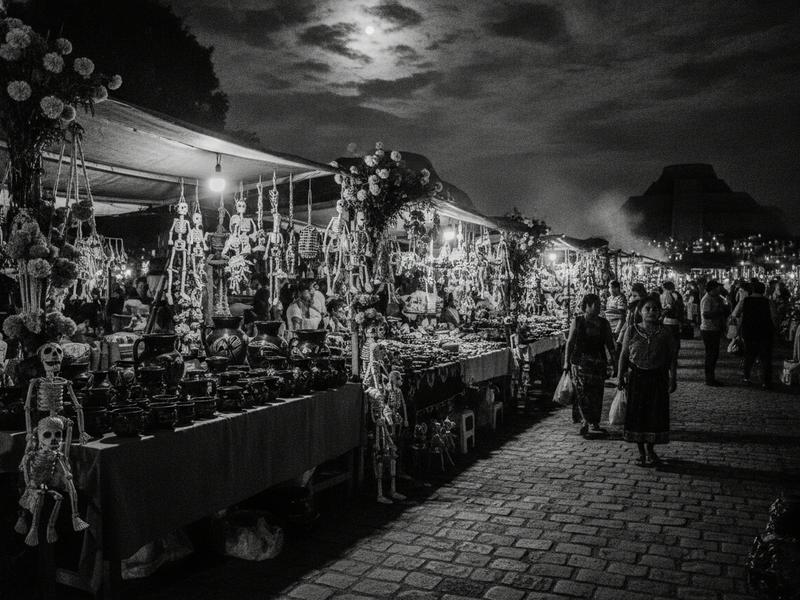 Tzintzuntzan craft and food market illuminated at night during Day of the Dead